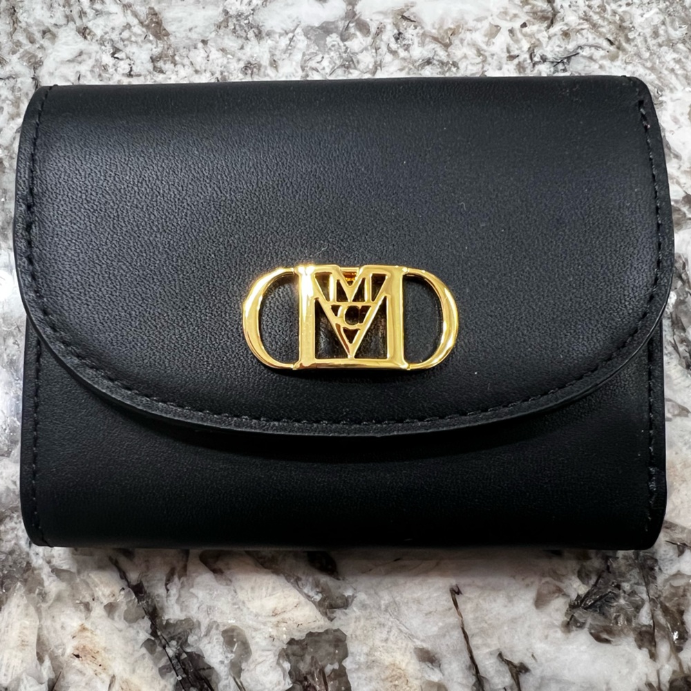 MCM mini travia wallet with gold chain.